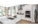 Modern kitchen featuring stainless steel appliances, quartz countertops, white cabinets, and a breakfast bar with seating at 564 Richfield Way, Summerville, SC 29486