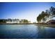 Scenic lake view with tree-lined shore and house on the right at 564 Richfield Way, Summerville, SC 29486
