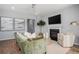 Comfortable living room showcasing a fireplace, stylish decor, and a ceiling fan at 564 Richfield Way, Summerville, SC 29486