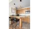 Kitchen with stainless steel appliances, granite counters, and bar-style seating at 5800 Palmetto Dr # Vg-105, Isle of Palms, SC 29451