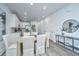 Bright dining room featuring a wooden table with upholstered chairs and modern decor at 704 Twin Rivers Dr # 44, Wando, SC 29492