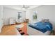 Bedroom featuring bright windows, a wooden desk, hardwood floors, and playful bedding at 716 Muirhead Rd, Mount Pleasant, SC 29464