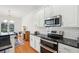 Modern kitchen with granite countertops, stainless steel appliances and white cabinets at 716 Muirhead Rd, Mount Pleasant, SC 29464