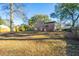 This backyard shows a spacious yard with a patio that offers space for outdoor living at 7639 Northhaven Dr, North Charleston, SC 29420