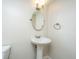 Pedestal sink in bathroom offers a minimalist and functional space at 7639 Northhaven Dr, North Charleston, SC 29420