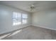 Neutral bedroom with a ceiling fan, carpet and natural light at 7639 Northhaven Dr, North Charleston, SC 29420