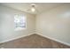 Bedroom featuring neutral carpet, natural light from a window, and ceiling fan at 7639 Northhaven Dr, North Charleston, SC 29420