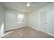 Inviting bedroom features neutral walls, carpet, ceiling fan, and bright windows at 7639 Northhaven Dr, North Charleston, SC 29420