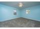 Bright bedroom features light blue walls, neutral carpet and ceiling fan at 7639 Northhaven Dr, North Charleston, SC 29420