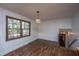 Dining room features wood flooring and natural light from a large window at 7639 Northhaven Dr, North Charleston, SC 29420