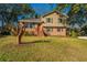 Charming two-story home with a brick facade and a large grassy front yard at 7639 Northhaven Dr, North Charleston, SC 29420