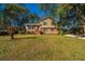 Charming two-story home with a brick facade and a large grassy front yard at 7639 Northhaven Dr, North Charleston, SC 29420