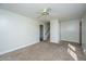 Bright living room with neutral carpet and access to a staircase at 7639 Northhaven Dr, North Charleston, SC 29420
