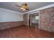 Open living area with modern flooring and brick accent wall at 7639 Northhaven Dr, North Charleston, SC 29420