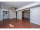 Open layout living room with modern flooring and doorway into other rooms at 7639 Northhaven Dr, North Charleston, SC 29420