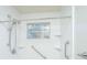 Bright walk in shower featuring grab bars and tiled walls, and rainfall shower head at 7639 Northhaven Dr, North Charleston, SC 29420
