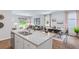 Granite kitchen island open to living and dining rooms, offering extra seating and serving space at 838 Lilyford Ln, Summerville, SC 29486