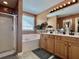 Bright bathroom with a soaking tub, double sink vanity, and modern fixtures at 9656 Pebble Creek Blvd, Summerville, SC 29485