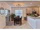 Cozy dining area with a modern light fixture and view of the kitchen at 9656 Pebble Creek Blvd, Summerville, SC 29485