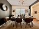 Stylish dining room with a table set for a dinner party, featuring unique lighting and decor at 9656 Pebble Creek Blvd, Summerville, SC 29485