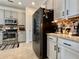 Modern kitchen with stainless steel appliances, dark countertops, and ample cabinet space at 9656 Pebble Creek Blvd, Summerville, SC 29485