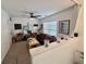 Inviting living room with a comfortable blue sofa, modern artwork, and plenty of natural light at 9656 Pebble Creek Blvd, Summerville, SC 29485