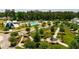 Expansive aerial view of the community showcasing manicured green spaces, pool, and amenities at 972 Carnes Crossing Blvd, Summerville, SC 29486