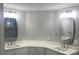 Dual sink bathroom vanity, modern light fixtures, framed mirrors, and bright countertops at Ln, Walterboro, SC 29488