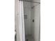 Tiled shower with a glass door featuring gray tile walls, and a modern showerhead at Ln, Walterboro, SC 29488