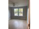 Bedroom featuring wood floors, a ceiling fan and a double window providing natural light at Ln, Walterboro, SC 29488