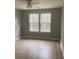 Spacious bedroom featuring two windows and a ceiling fan at Ln, Walterboro, SC 29488
