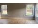 Bright bedroom featuring wood-look flooring, ample natural light through windows, and neutral wall paint at Ln, Walterboro, SC 29488