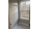 A closet featuring a wire rack shelf and a window providing natural light at Ln, Walterboro, SC 29488