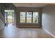 Bright living room with a view to the outside through large windows, showcasing ample space and natural light at Ln, Walterboro, SC 29488