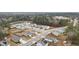 A high-angle shot capturing a residential neighborhood with contemporary homes nestled by a tranquil pond at 103 Cardinal Flower Ct, Moncks Corner, SC 29461