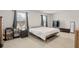 Bright bedroom with lots of natural light, carpeted floors, and decorated with lamps, plants, and paintings at 103 Cardinal Flower Ct, Moncks Corner, SC 29461