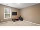 Multi-purpose room with natural light, TV, small table, and gym equipment for various activities at 103 Cardinal Flower Ct, Moncks Corner, SC 29461