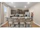 Modern kitchen with an island, stainless appliances, granite countertops, and neutral accents at 103 Cardinal Flower Ct, Moncks Corner, SC 29461