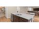 Modern kitchen with stainless appliances, granite countertops, and a connected living space at 103 Cardinal Flower Ct, Moncks Corner, SC 29461