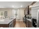 Spacious kitchen with stainless appliances, granite countertops, and natural light at 103 Cardinal Flower Ct, Moncks Corner, SC 29461