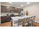 Modern kitchen showcasing granite counters, stainless steel appliances, and a pantry at 103 Cardinal Flower Ct, Moncks Corner, SC 29461