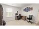 Bright office space with a large window, wooden desk, and modern black and gray office chairs at 103 Cardinal Flower Ct, Moncks Corner, SC 29461