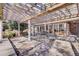 Backyard patio with pergola, outdoor seating and view to the house's patio doors at 108 Tea Farm Rd, Summerville, SC 29483