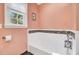Bright bathroom showcasing a pristine tub and subtle tile accents creating a clean design at 108 Tea Farm Rd, Summerville, SC 29483