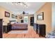 Bedroom with wood floors, stylish black furniture, a ceiling fan, and natural light at 108 Tea Farm Rd, Summerville, SC 29483