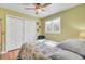 Bright bedroom with nautical themed bedding, a window, and closet doors at 108 Tea Farm Rd, Summerville, SC 29483