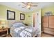 Cozy bedroom features a ceiling fan and coastal-themed decor, creating a relaxing retreat at 108 Tea Farm Rd, Summerville, SC 29483