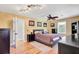 Spacious bedroom features wood floors, a ceiling fan, and ample natural light at 108 Tea Farm Rd, Summerville, SC 29483