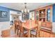 Well-appointed dining room featuring a large wooden table, hutch, chandelier, and access to living spaces at 108 Tea Farm Rd, Summerville, SC 29483