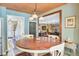 Charming dining room features a wood table, seating for four, and an open view of the fireplace at 108 Tea Farm Rd, Summerville, SC 29483